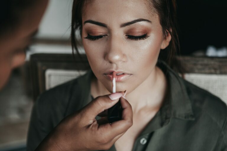 glowing makeup, woman and man near white wall
