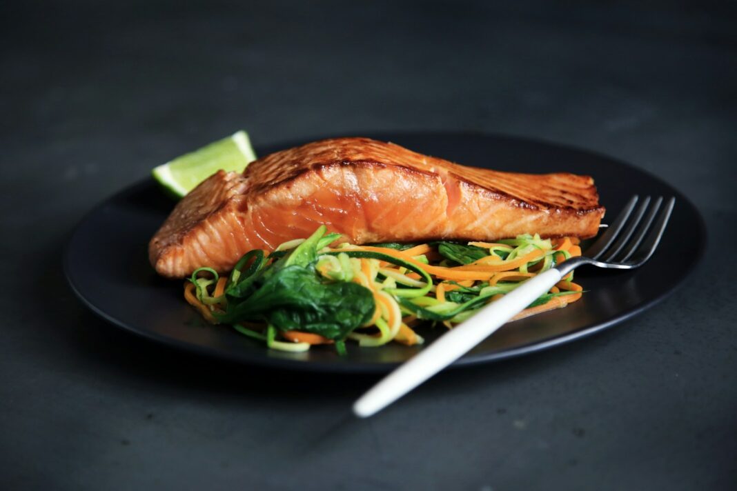grilled fish, cooked vegetables, and fork on plate, The Best Baked Salmon