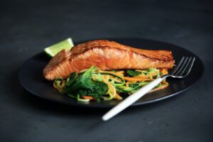 grilled fish, cooked vegetables, and fork on plate, The Best Baked Salmon