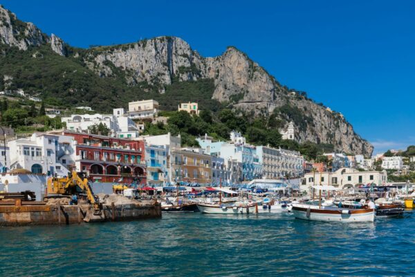capri, a harbor filled with lots of boats next to a mountain