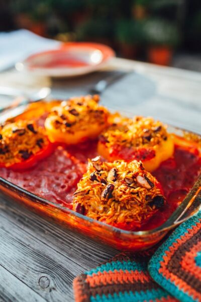 brown and red dish on brown wooden tray, Stuffed Bell Peppers