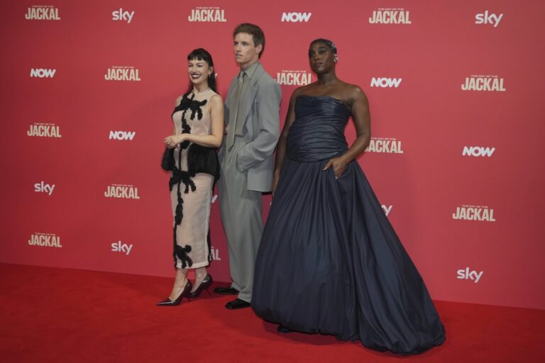 From left, Spanish actress Ursula Corbero, British actor Eddie Redmayne and British actress Lashana Lynch pose for photos on the red carpet at the "The Day of the Jackal" premiere in London, Tuesday, Oct. 22, 2024. (AP Photo/Kin Cheung)