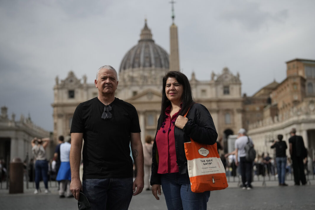 Peruvian journalists, Pedro Salinas, left, and Paola Ugaz, who have denounced the abuses of the Sodalitium of Christian Life group in Peru, pose for a portrait in front of St. Peters's Square at the Vatican, Thursday, Oct. 17, 2024. (AP Photo/Alessandra Tarantino)