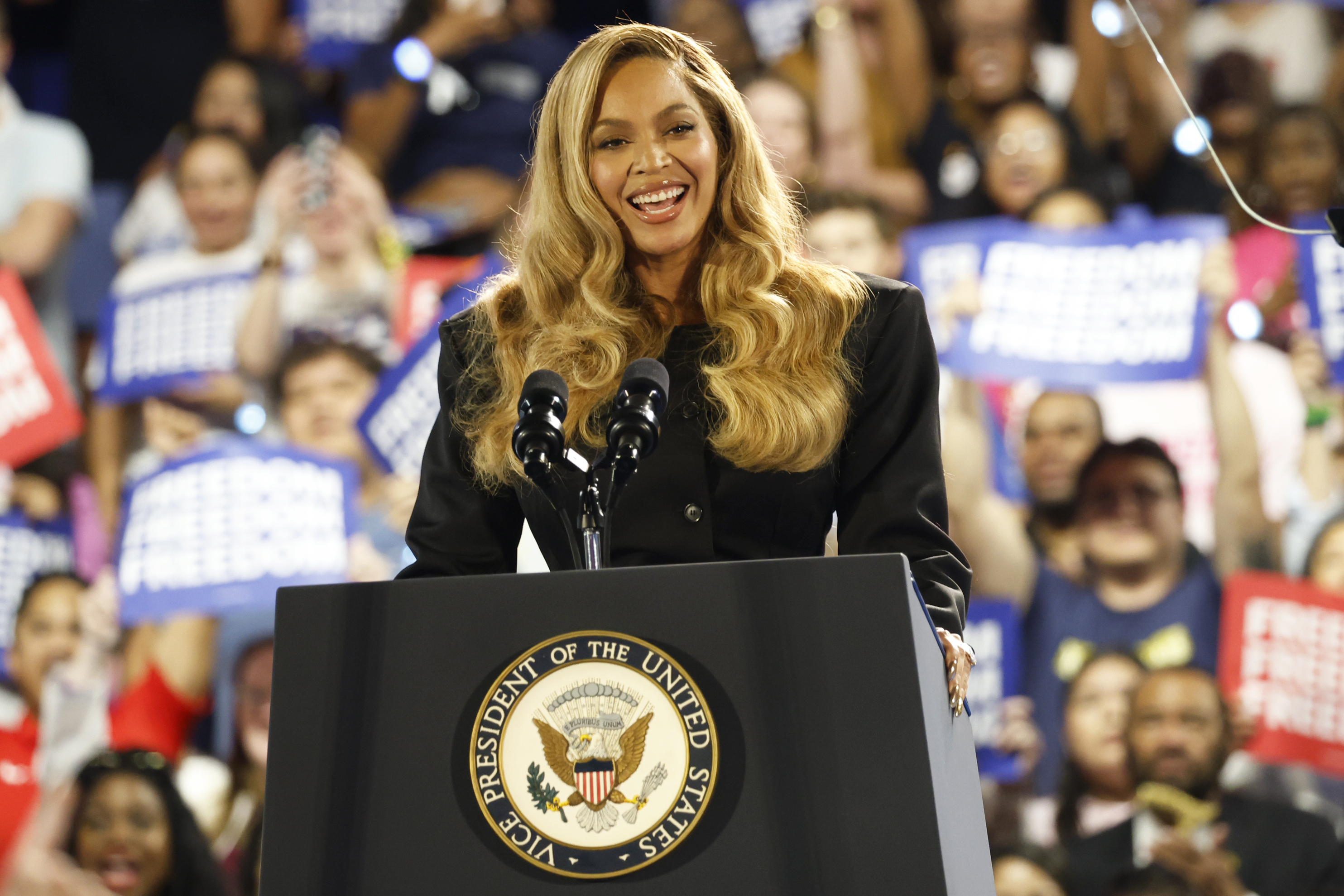 Musical artist Beyonce on stage at a campaign