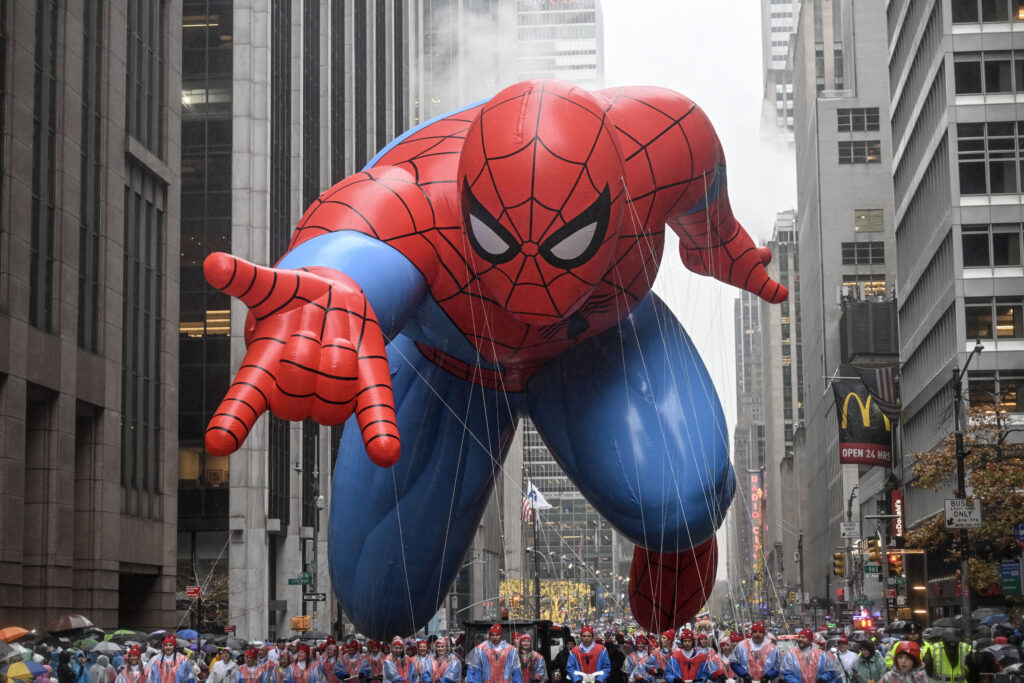 NEW YORK, NY - NOVEMBER 28: A giant balloon of the Spider-Man floats through the streets during the Macy's Thanksgiving Day Parade, captivating tens of thousands of spectators despite the rainy weather in New York, United States on November 28, 2024. (Photo by Fatih Aktas/Anadolu via Getty Images)
