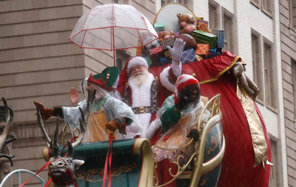NEW YORK, NY - NOVEMBER 28: Santa Claus waves from his float along Central Park West during the Macy's Thanksgiving Day Parade in New York City on November 28, 2024, in New York City. (Photo by Gary Hershorn/Getty Images)