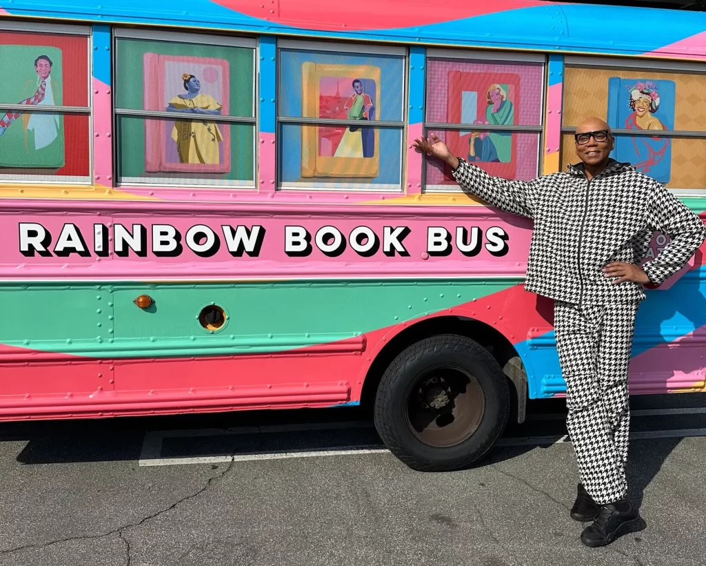 Drag sensation RuPaul stands in front of the Rainbow Book Bus, which is traveling across the South distributing banned books to needy readers (Photo: RAINBOW BOOK BUS)