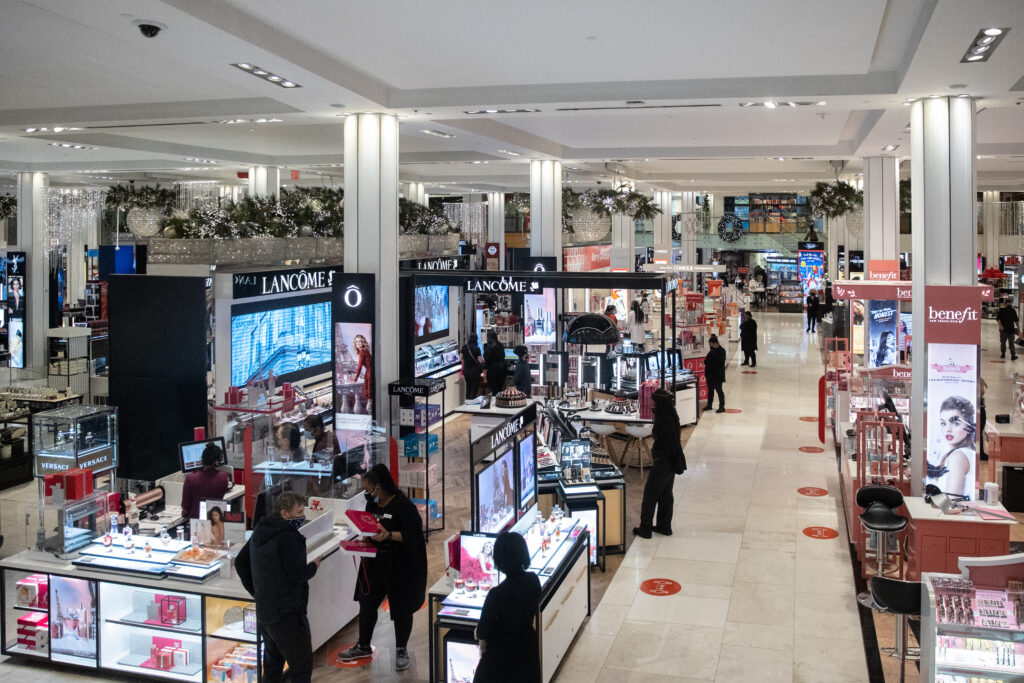 NEW YORK, NY - NOVEMBER 27: Staffs wearing protective masks are seen at Macy's store on November 27, 2020 in New York, United States. Shoppers go out early despite ongoing concerns and limitations due to COVID-19 this year. (Photo by Jeenah Moon/Getty Images)