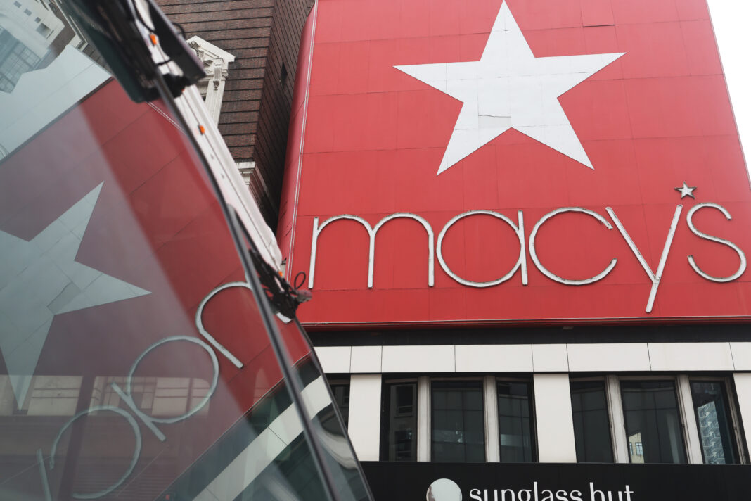 NEW YORK, NEW YORK - MARCH 02: The Macy's company signage is seen at the Herald Square store on March 02, 2023 in New York City. Macy's Inc. stock jumped 14.8% in premarket trade on Thursday, after the department store chain exceeded forecasted estimates for the fourth quarter. The company posted a net income of $508 million for the quarter to Jan. 28, which was down from $742 million in the year-earlier period. While sales fell the company offered upbeat guidance for fiscal 2023. (Photo by Michael M. Santiago/Getty Images)