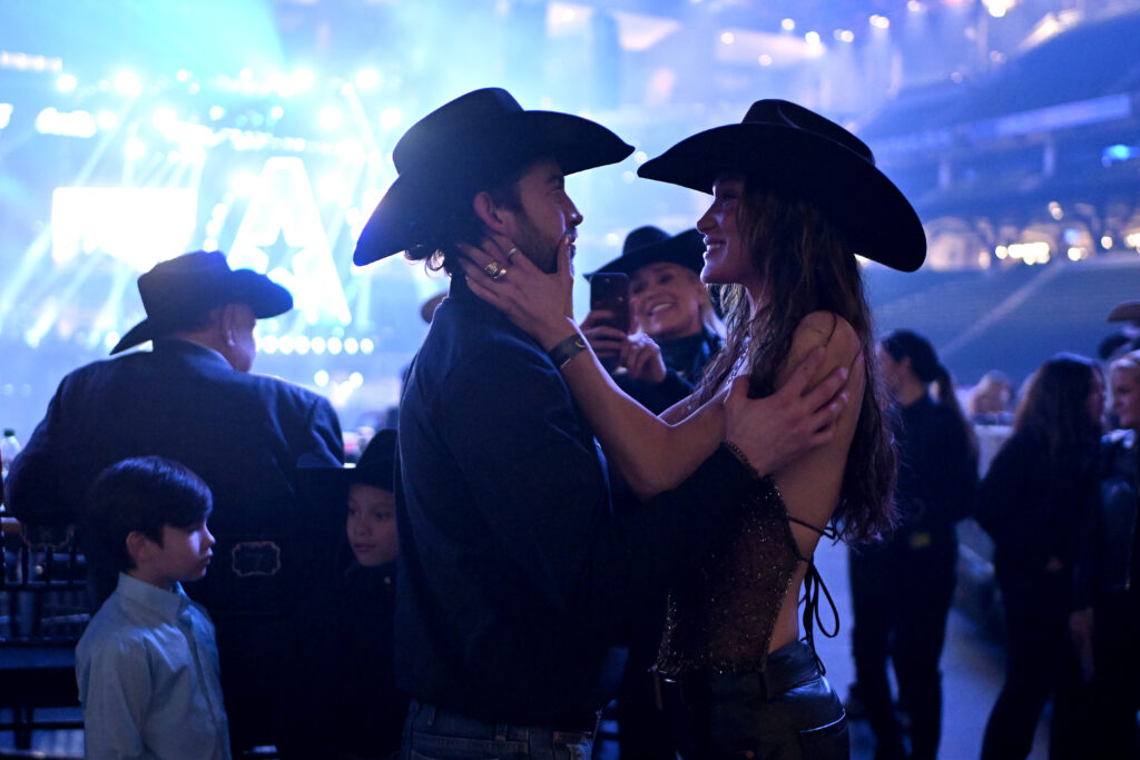ARLINGTON, TEXAS - MARCH 08: Adan Banuelos and Bella Hadid attend The American Performance Horseman by Teton Ridge at Globe Life Field on March 08, 2024 in Arlington, Texas. (Photo by Click Thompson/Getty Images for Teton Ridge)