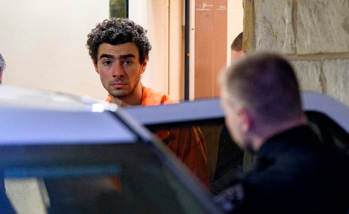 HOLLIDAYSBURG, PENNSYLVANIA - DECEMBER 10: Suspected shooter Luigi Mangione is led from the Blair County Courthouse after an extradition hearing December 10, 2024 in Hollidaysburg, Pennsylvania. Mangione has been arraigned on weapons and false identification charges related to the fatal shooting of United Healthcare CEO Brian Thompson in New York City. Mangione is incarcerated in the State Correctional Institution in Huntingdon, Pennsylvania awaiting extradition to New York. (Photo by Jeff Swensen/Getty Images)