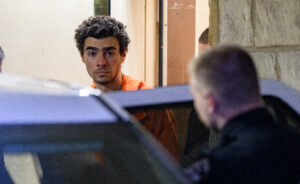 HOLLIDAYSBURG, PENNSYLVANIA - DECEMBER 10: Suspected shooter Luigi Mangione is led from the Blair County Courthouse after an extradition hearing December 10, 2024 in Hollidaysburg, Pennsylvania. Mangione has been arraigned on weapons and false identification charges related to the fatal shooting of United Healthcare CEO Brian Thompson in New York City. Mangione is incarcerated in the State Correctional Institution in Huntingdon, Pennsylvania awaiting extradition to New York. (Photo by Jeff Swensen/Getty Images)