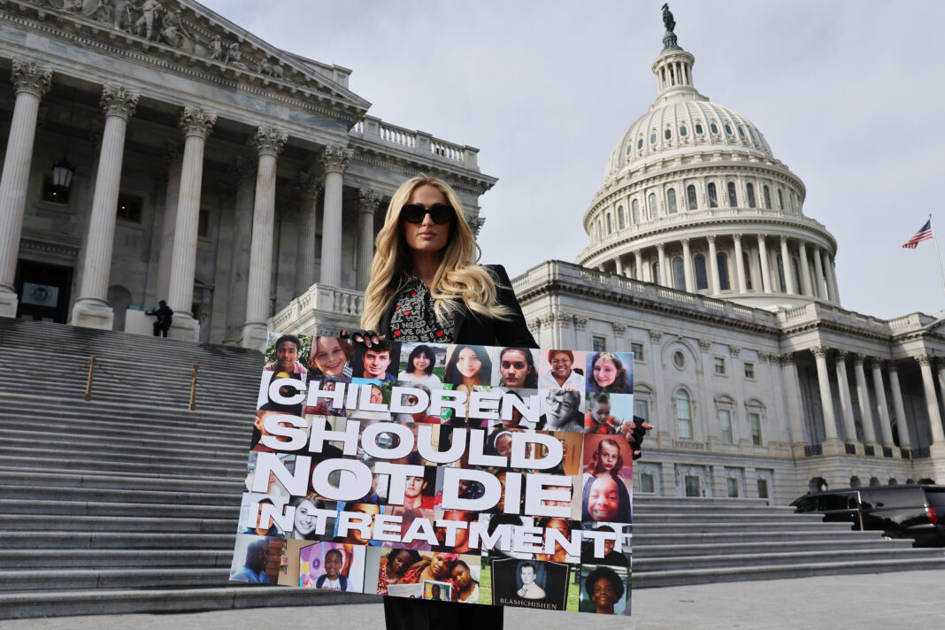 WASHINGTON, DC - DECEMBER 17: Celebrity hotel heiress Paris Hilton poses for photographs outside the U.S. Capitol on the day the House of Representatives is set to vote on The Stop Institutional Child Abuse Act on December 17, 2024 in Washington, DC. Citing her own traumatizing experience at Provo Canyon School in Utah when she was a teenager, Hilton has lobbied for three years for the legislations that would place greater federal safeguards on institutional youth treatment programs. (Photo by Chip Somodevilla/Getty Images)