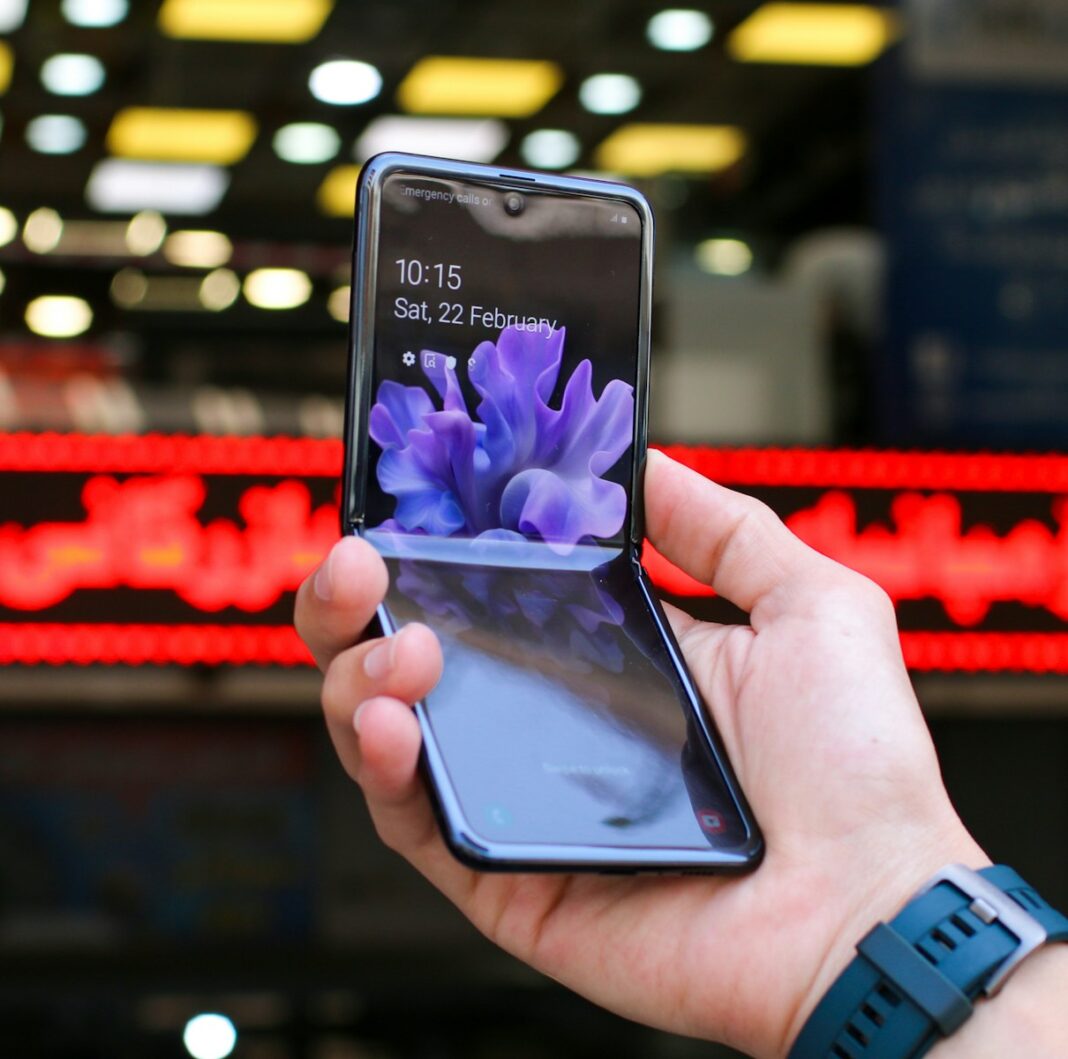 person holding black samsung android smartphone, foldable phone