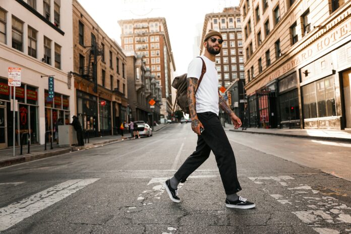 9 Ways to Squeeze in More Steps - man in white long sleeve shirt and black pants standing on road during daytime