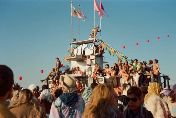 Dead Man Found - a crowd of people standing on top of a boat