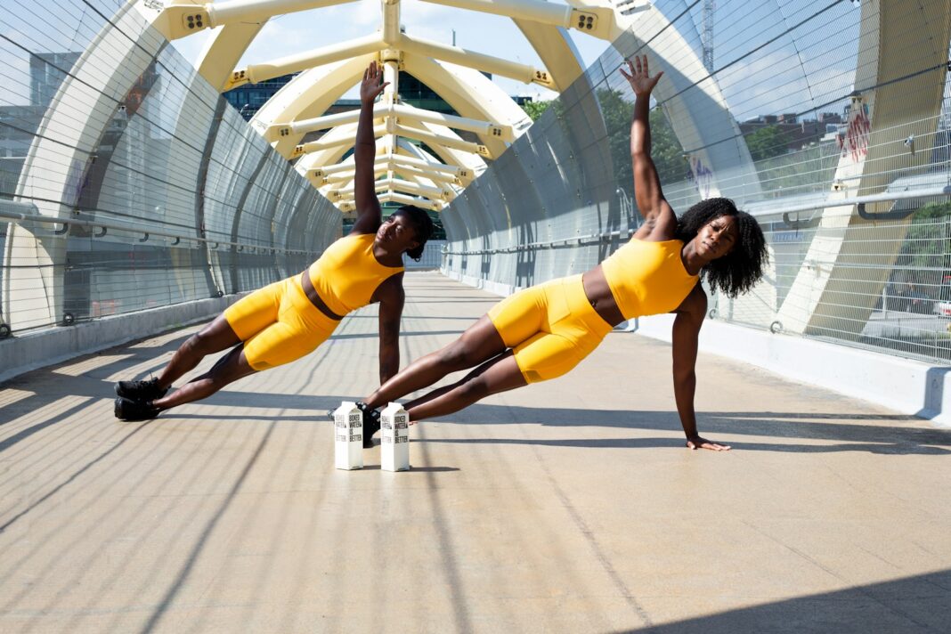3 Moves Build Strength - woman in yellow sports bra and yellow shorts jumping on white metal frame