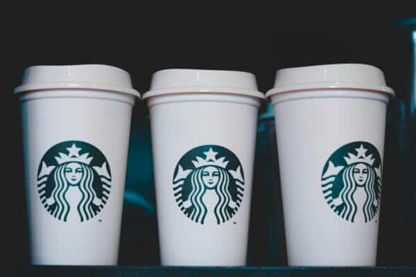 Starbucks Protein Lattes - two white starbucks disposable cups