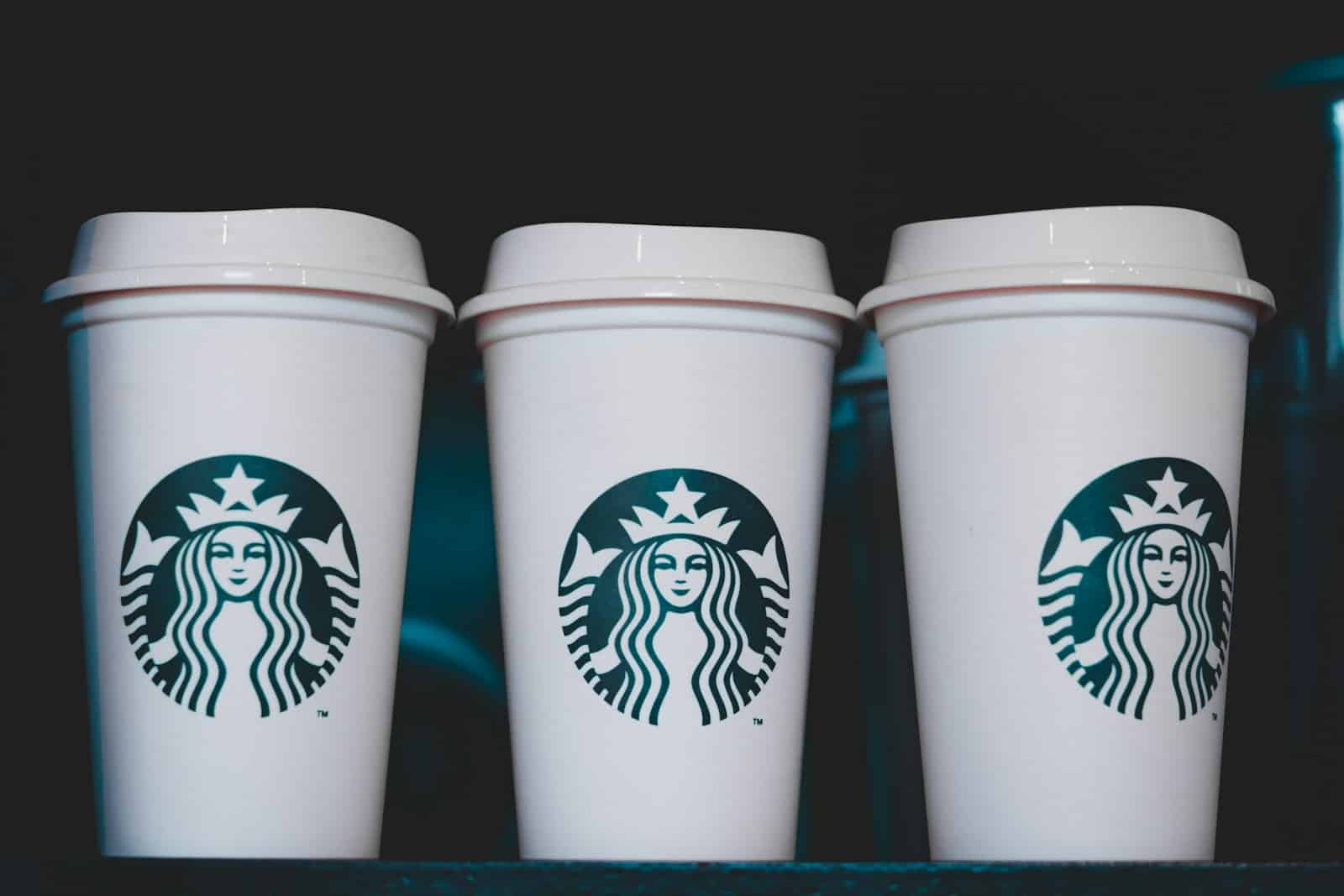 Starbucks Protein Lattes - two white starbucks disposable cups