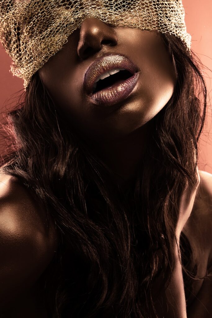 brown lipstick, woman wearing gold crown and gold crown