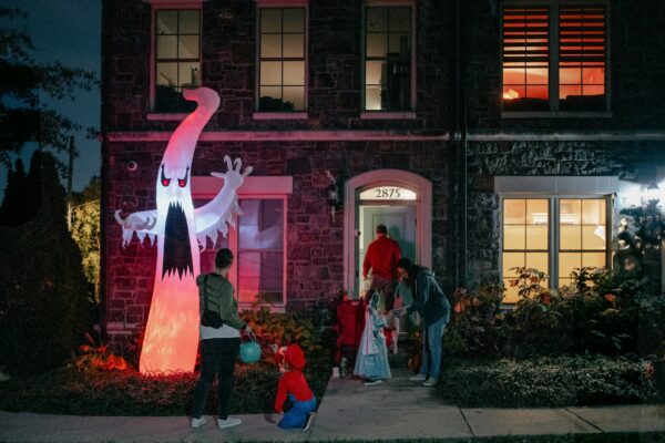 Halloween Danger - A group of people standing in front of a building