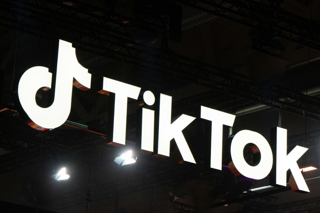 tiktok, a sign with white text