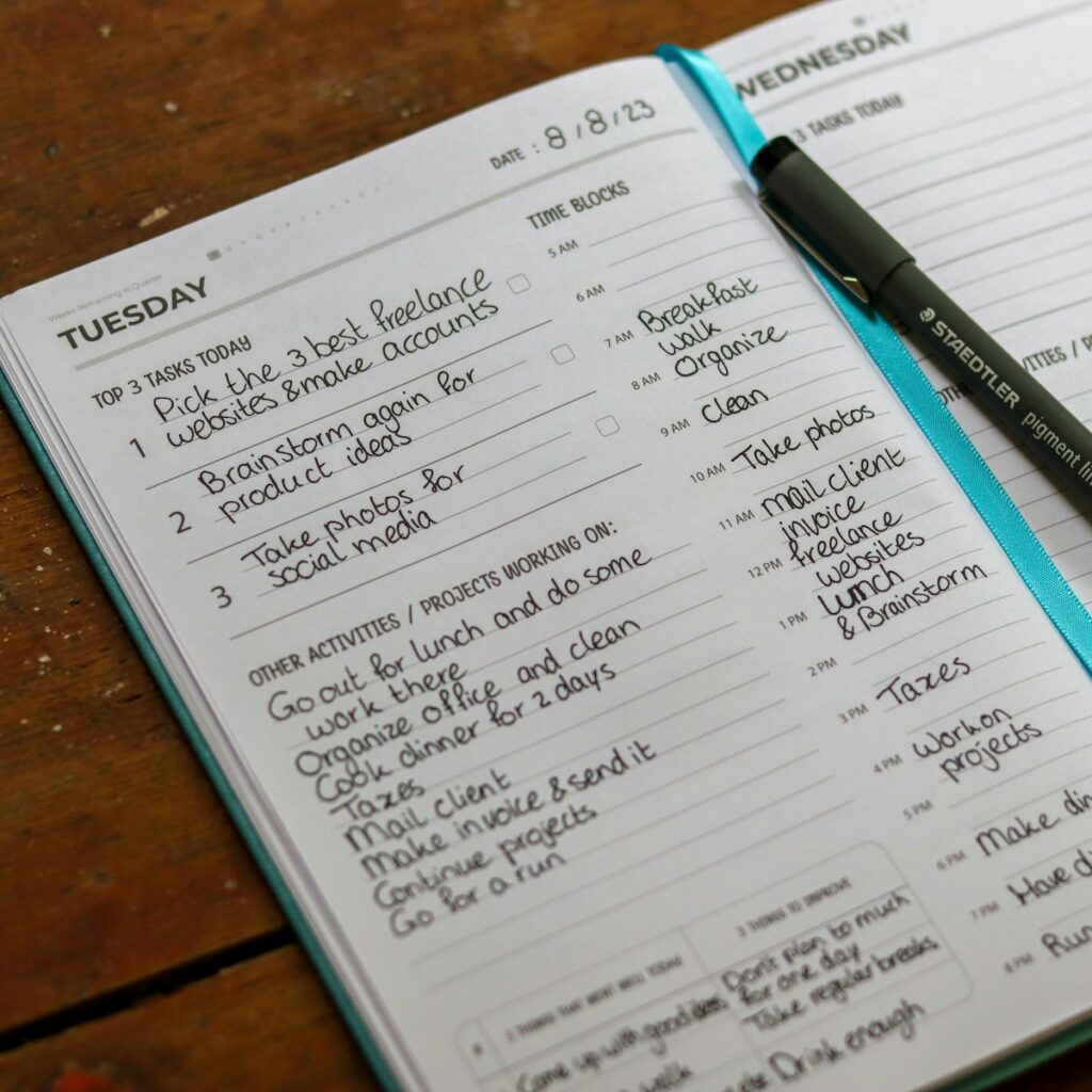 time management, a notebook with a pen on top of it
