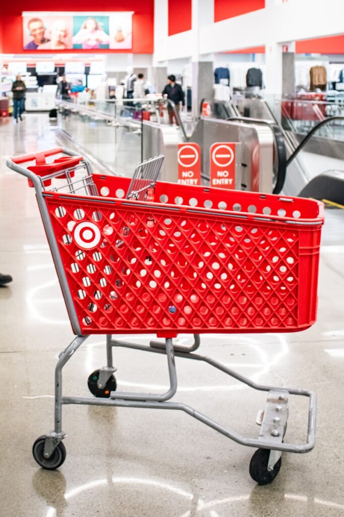 Target, A red target shopping cart sits in the store.