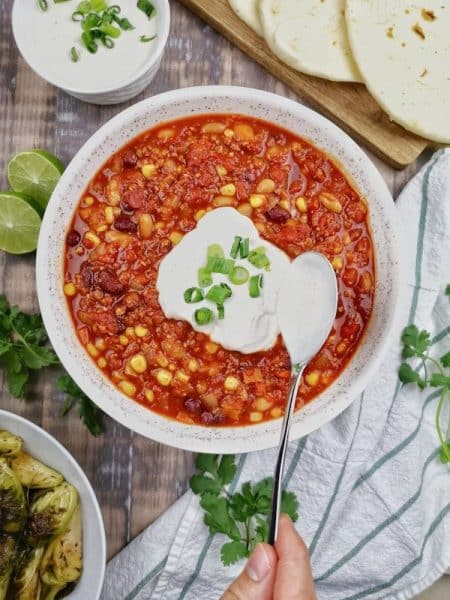 Hot Pants Chili  - a bowl of chili with sour cream on top