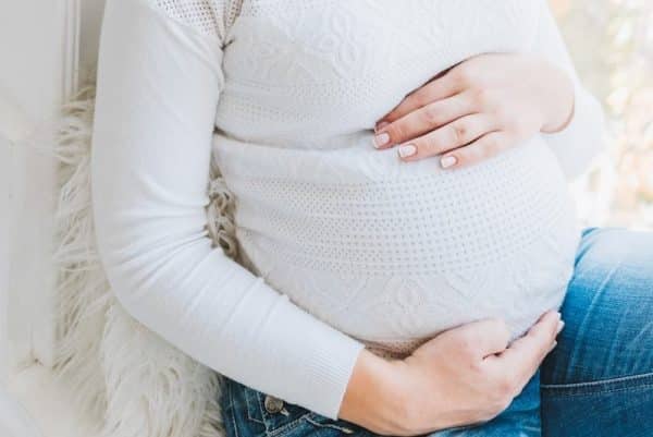 Pregnancy's Silent Threat: A Dietary Lifeline Revealed - woman in white long sleeve shirt