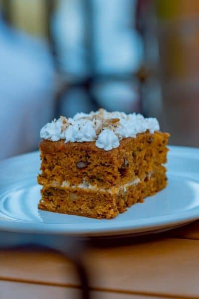 Pumpkin Spice Texas Sheet Cake - a piece of cake sitting on top of a white plate
