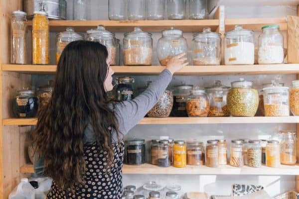 Pantry a person holding a jar of food